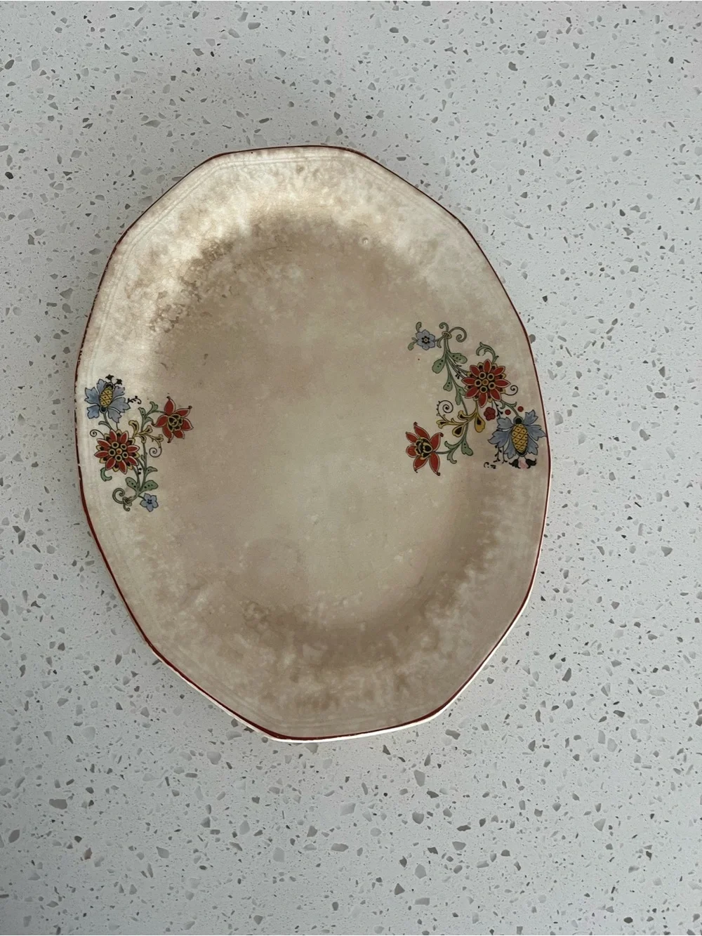Antique Cream Oval Serving Platter with Rusty Red and Blue Floral Accents.